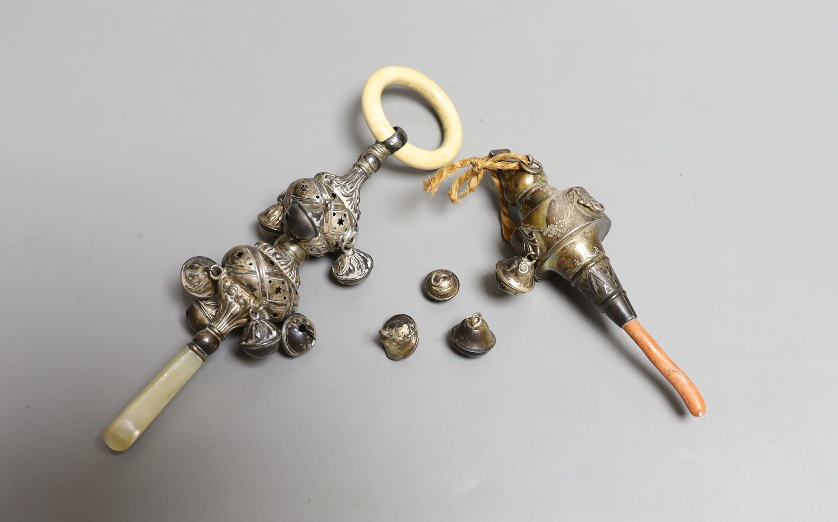 A George V silver, bone and mother of pearl mounted child's rattle, 16.1cm and a similar rattle with coral teether, both Crisford & Norris, Birmingham, 1911.